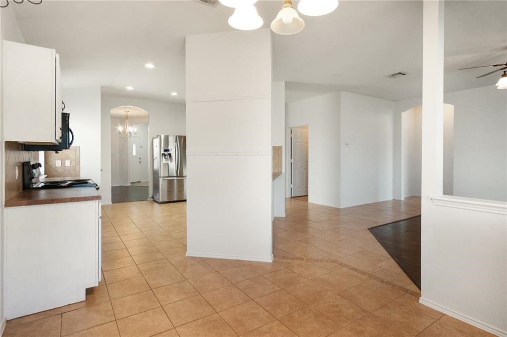 913 Cindy Lane Leander, TX 78641 - Photo 8 of 28 a view of a kitchen from the hallway