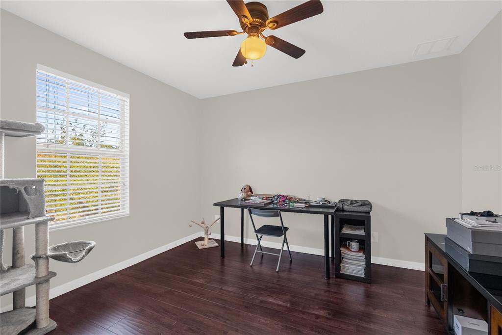 2096 Water Tupelo Way Ocoee, FL 34761 - Photo 15 of 32 a workspace with furniture hardwood and a window