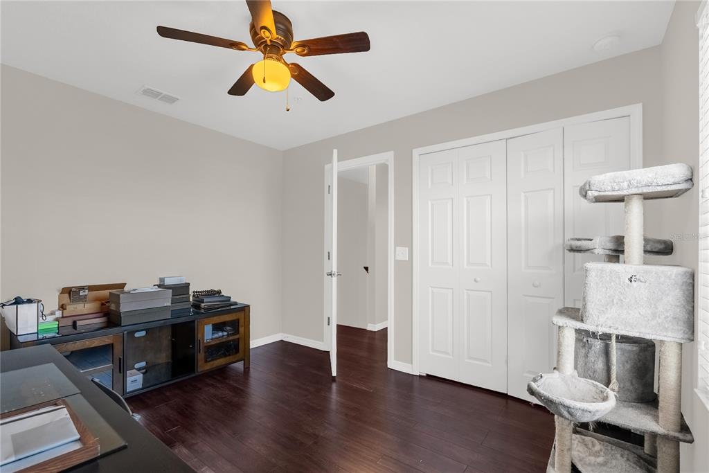 2096 Water Tupelo Way Ocoee, FL 34761 - Photo 16 of 32 a living room with furniture and a chandelier