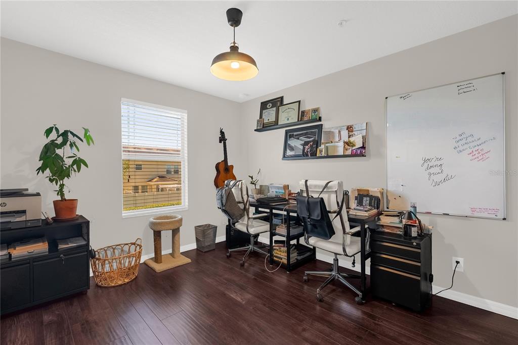 2096 Water Tupelo Way Ocoee, FL 34761 - Photo 17 of 32 a living room with furniture and wooden floor