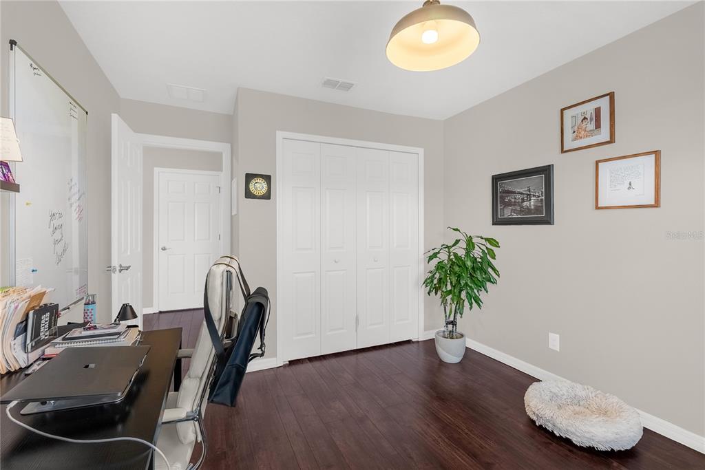 2096 Water Tupelo Way Ocoee, FL 34761 - Photo 18 of 32 a view of a workspace with furniture and a potted plant
