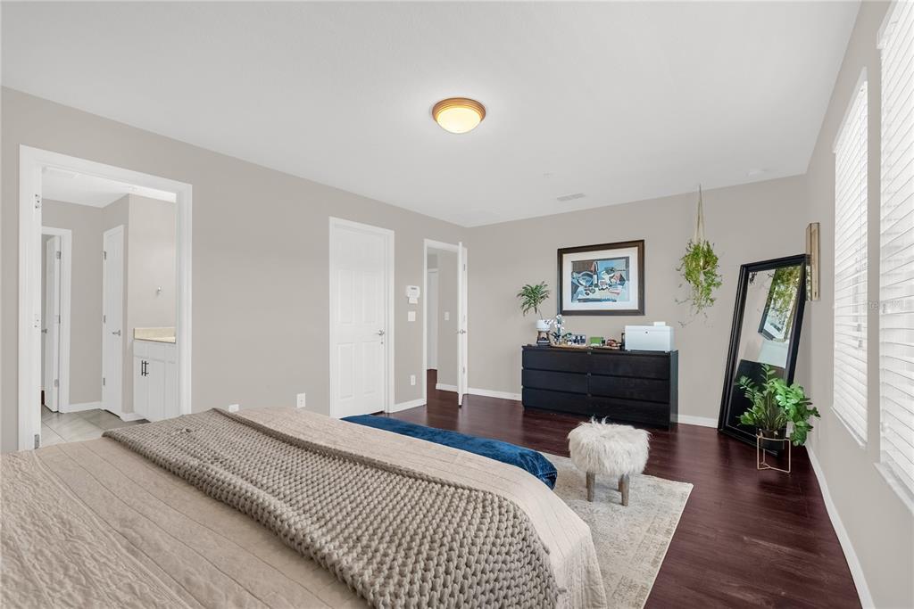 2096 Water Tupelo Way Ocoee, FL 34761 - Photo 20 of 32 a bedroom with a bed and a couch