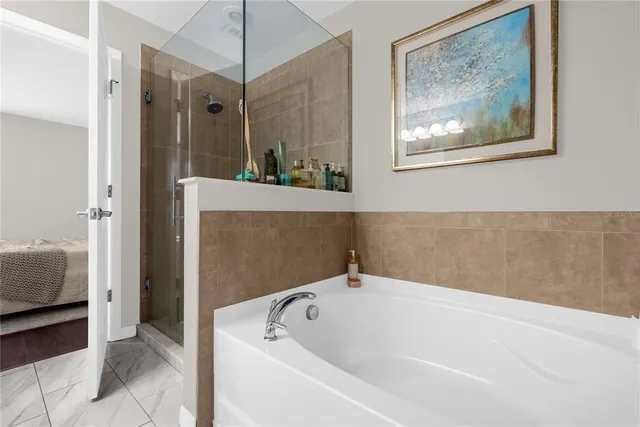 a bathroom with a sink vanity mirror and toilet