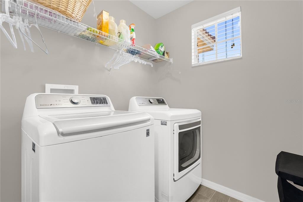 2096 Water Tupelo Way Ocoee, FL 34761 - Photo 26 of 32 a utility room with dryer and washer