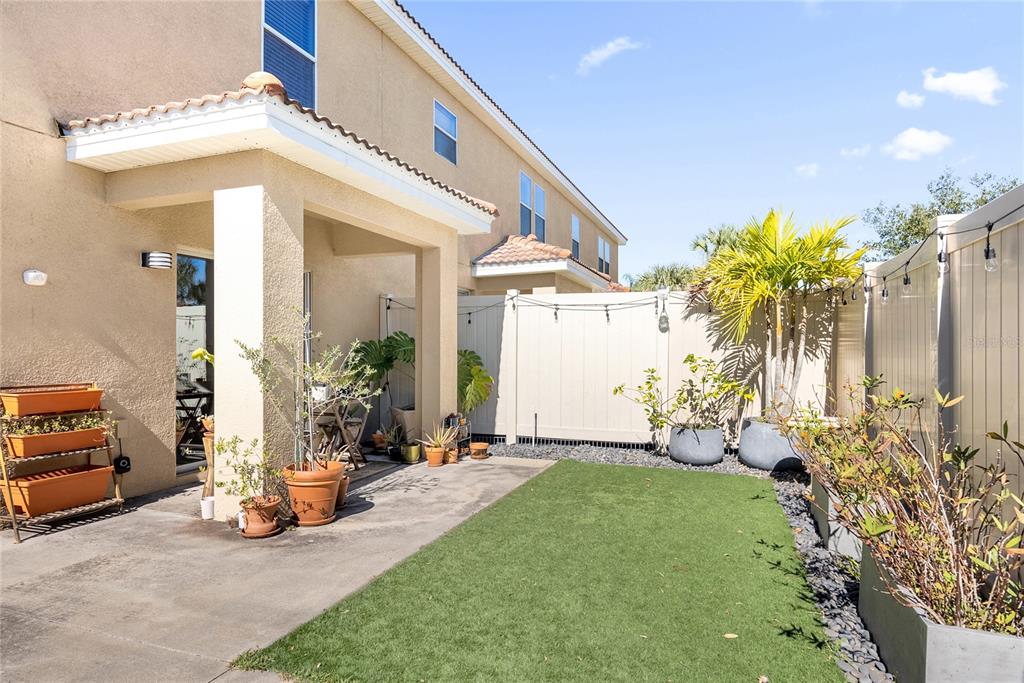 2096 Water Tupelo Way Ocoee, FL 34761 - Photo 27 of 32 a view of a chair and table in backyard