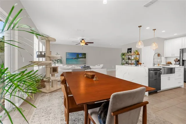 a dining room with furniture a window and kitchen view