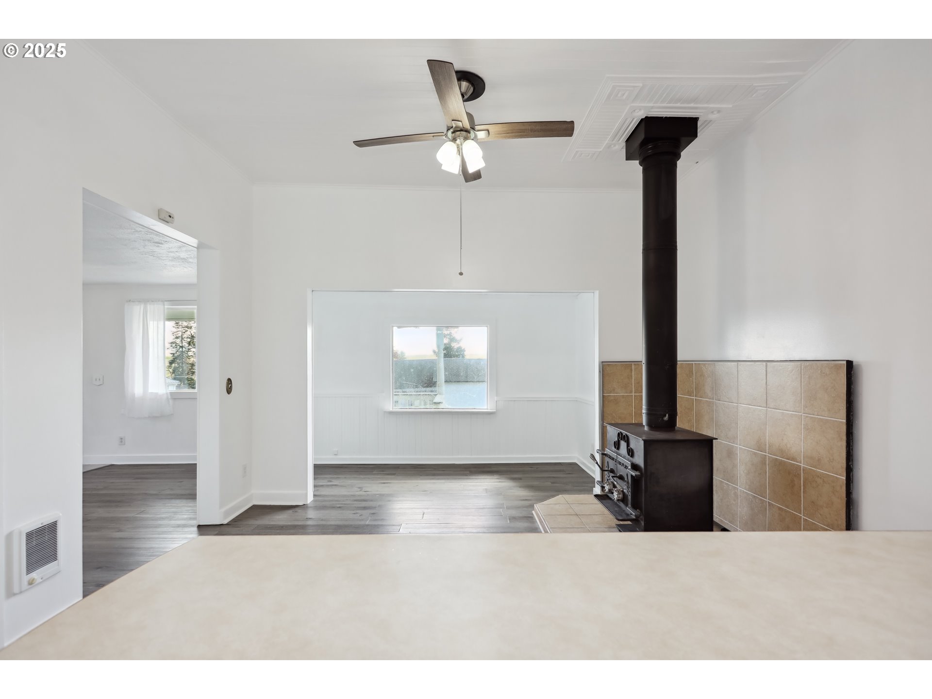400 Mc Coy Street Moro, OR 97039 - Photo 21 of 33 a living room with a bed and a chandelier