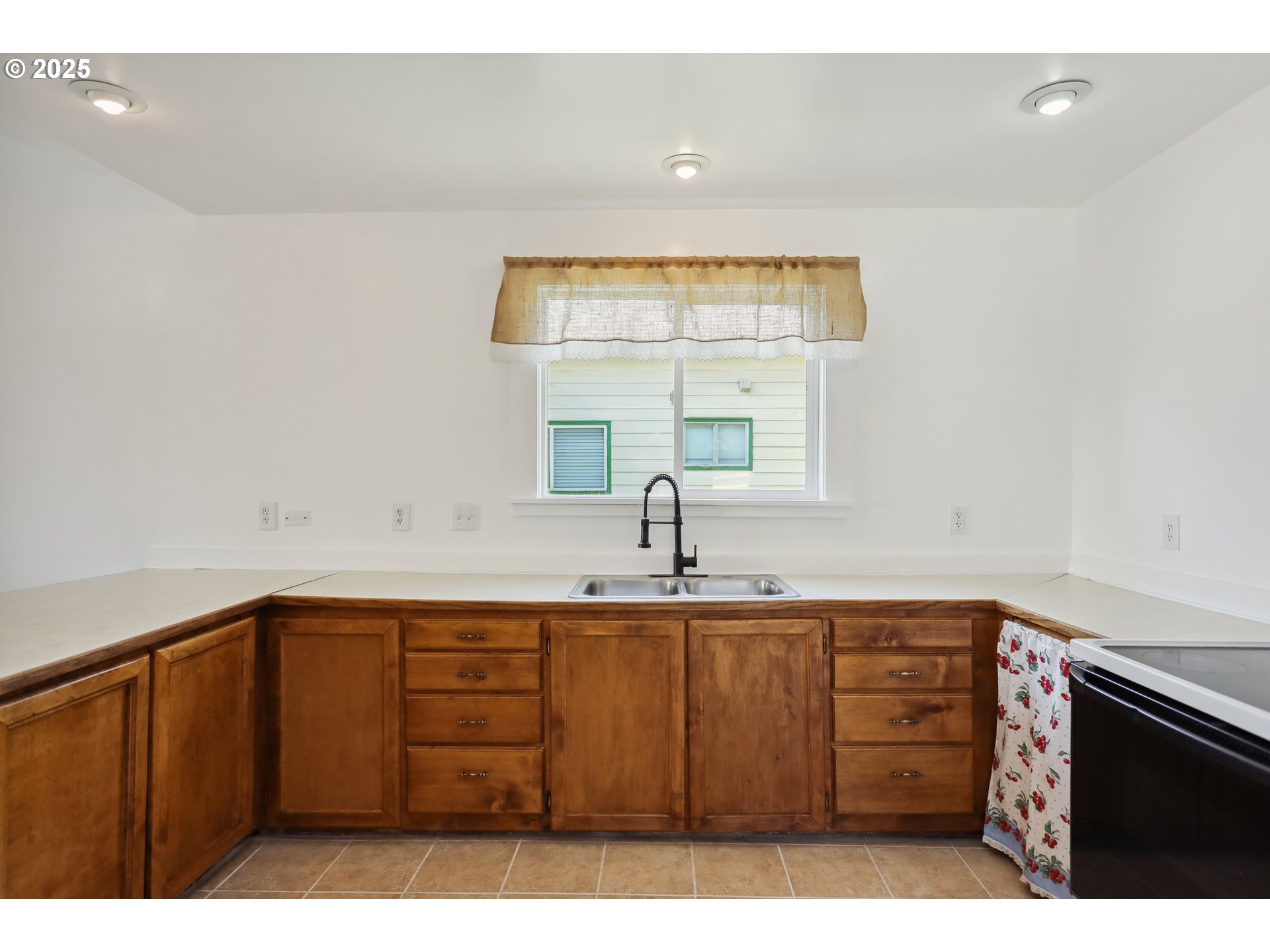 400 Mc Coy Street Moro, OR 97039 - Photo 24 of 33 a kitchen with a sink a window and cabinets