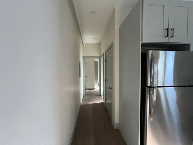 a view of a kitchen from the hallway