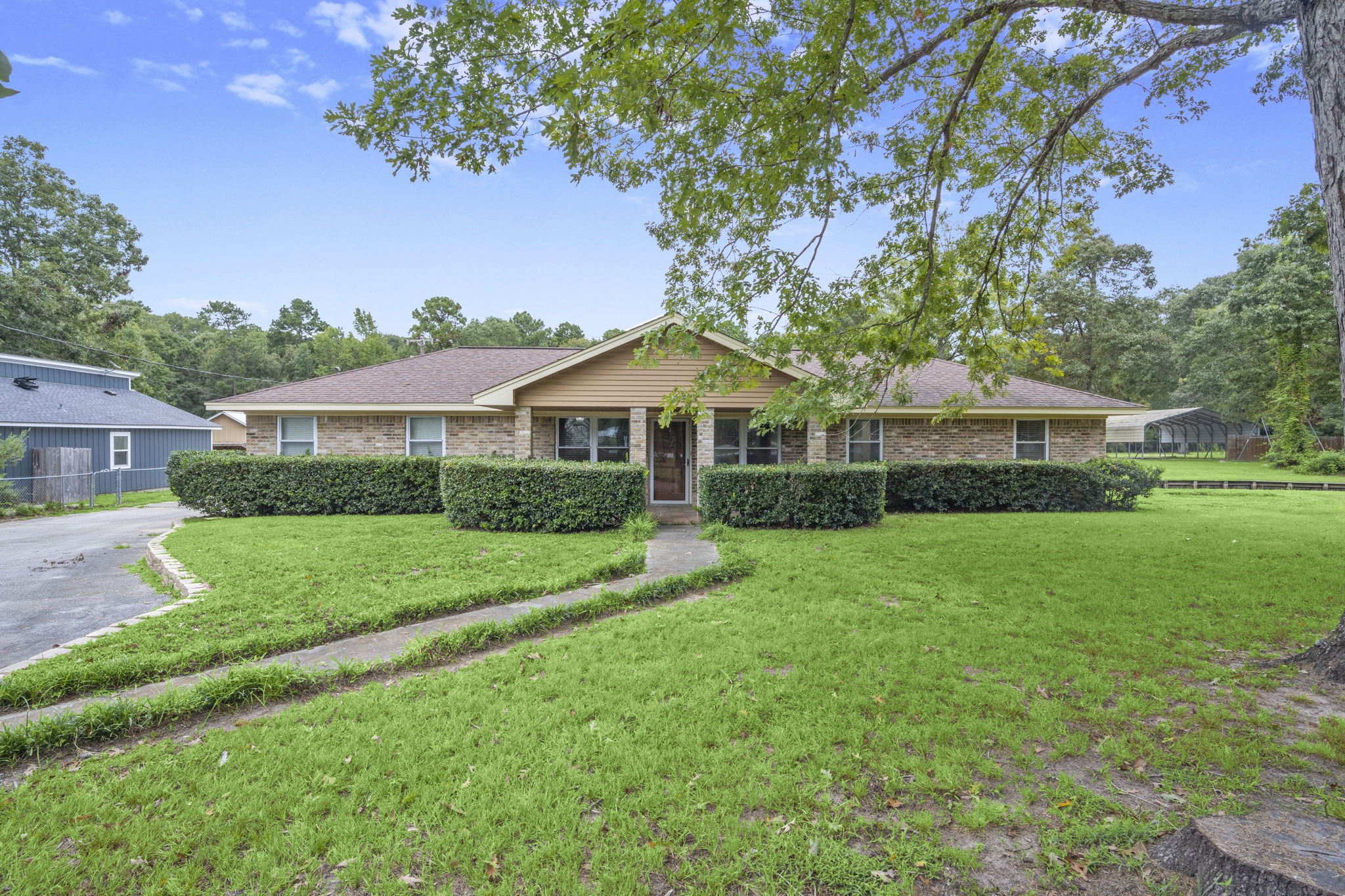 a front view of a house with a yard and porch