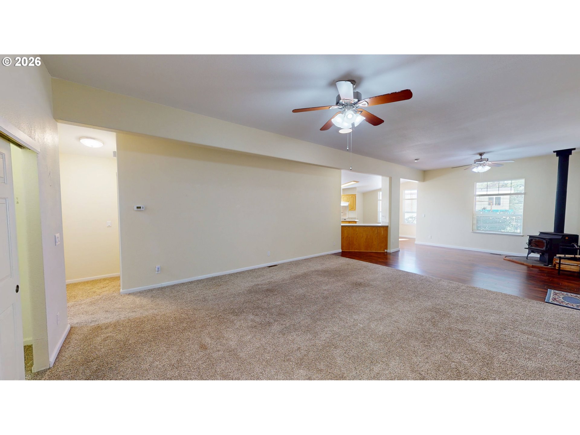 94355 11th Street Gold Beach, OR 97444 - Photo 18 of 41 a living room with furniture and a chandelier fan