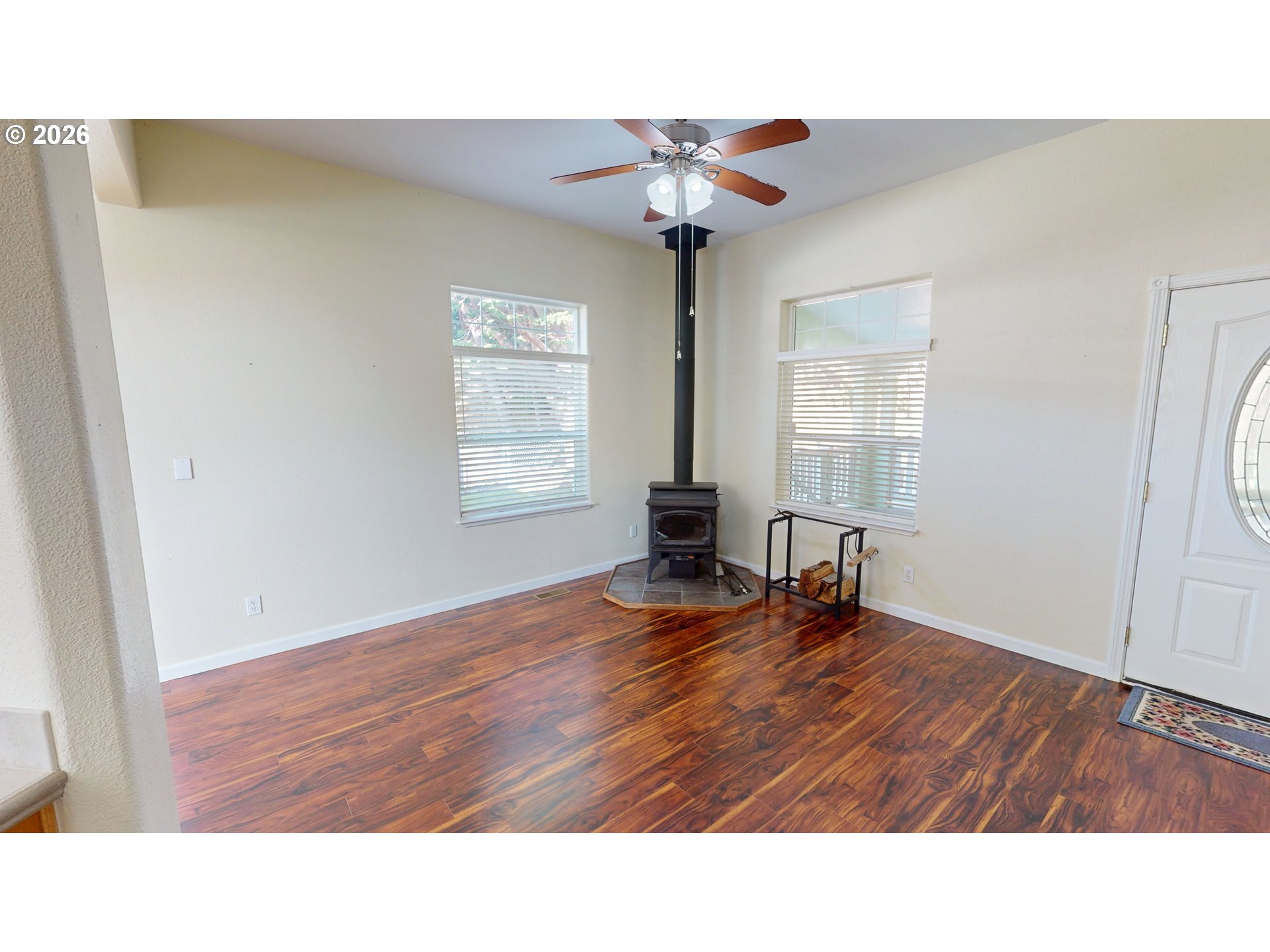 94355 11th Street Gold Beach, OR 97444 - Photo 19 of 41 a room with wooden floor and windows