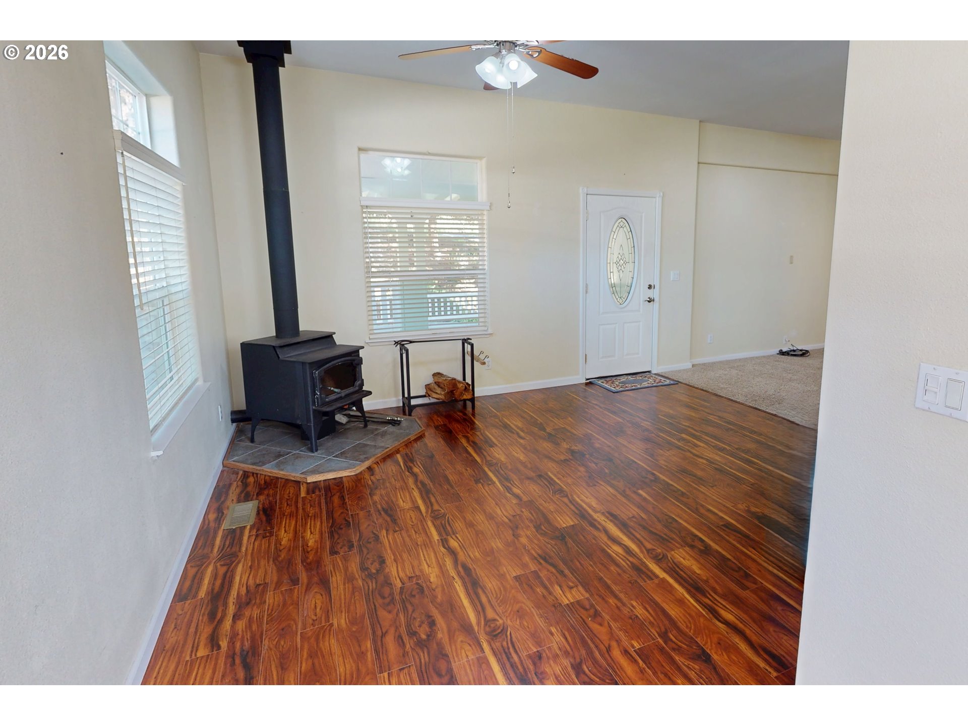 94355 11th Street Gold Beach, OR 97444 - Photo 20 of 41 a view of empty room with wooden floor and fan