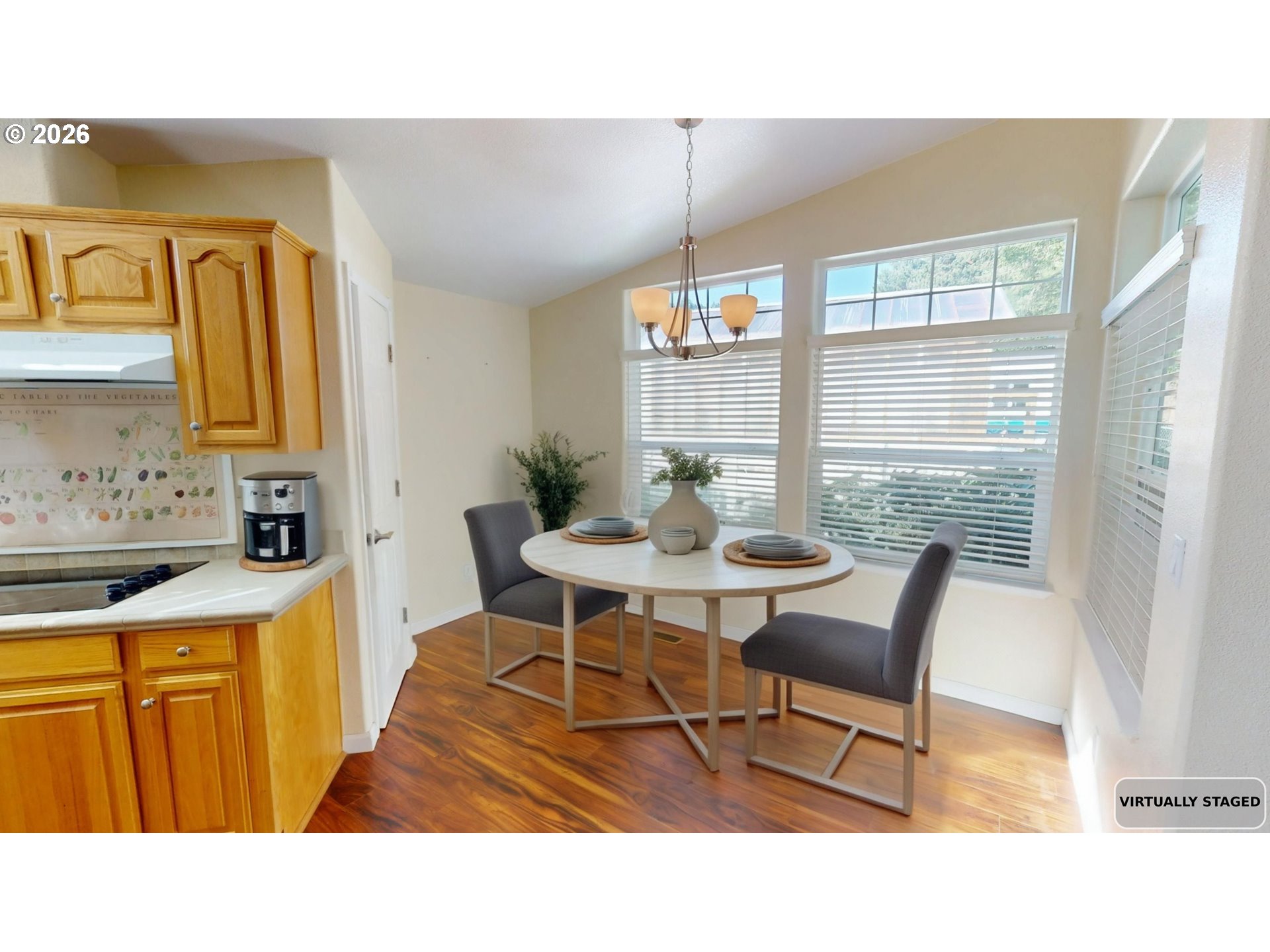 94355 11th Street Gold Beach, OR 97444 - Photo 22 of 41 a kitchen with stainless steel appliances kitchen island granite countertop a sink table and chairs