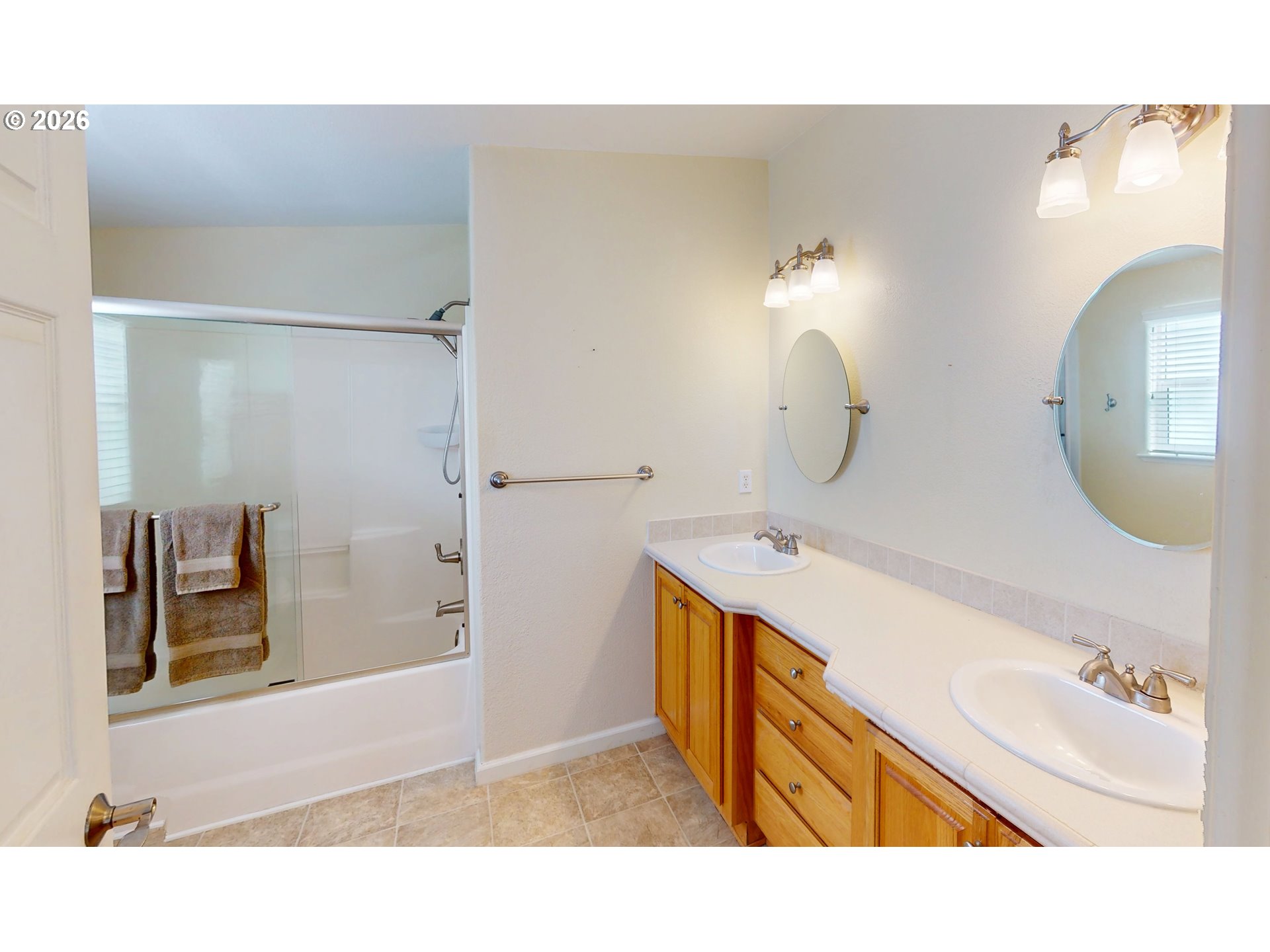 94355 11th Street Gold Beach, OR 97444 - Photo 27 of 41 a bathroom with a sink a mirror and a bathtub