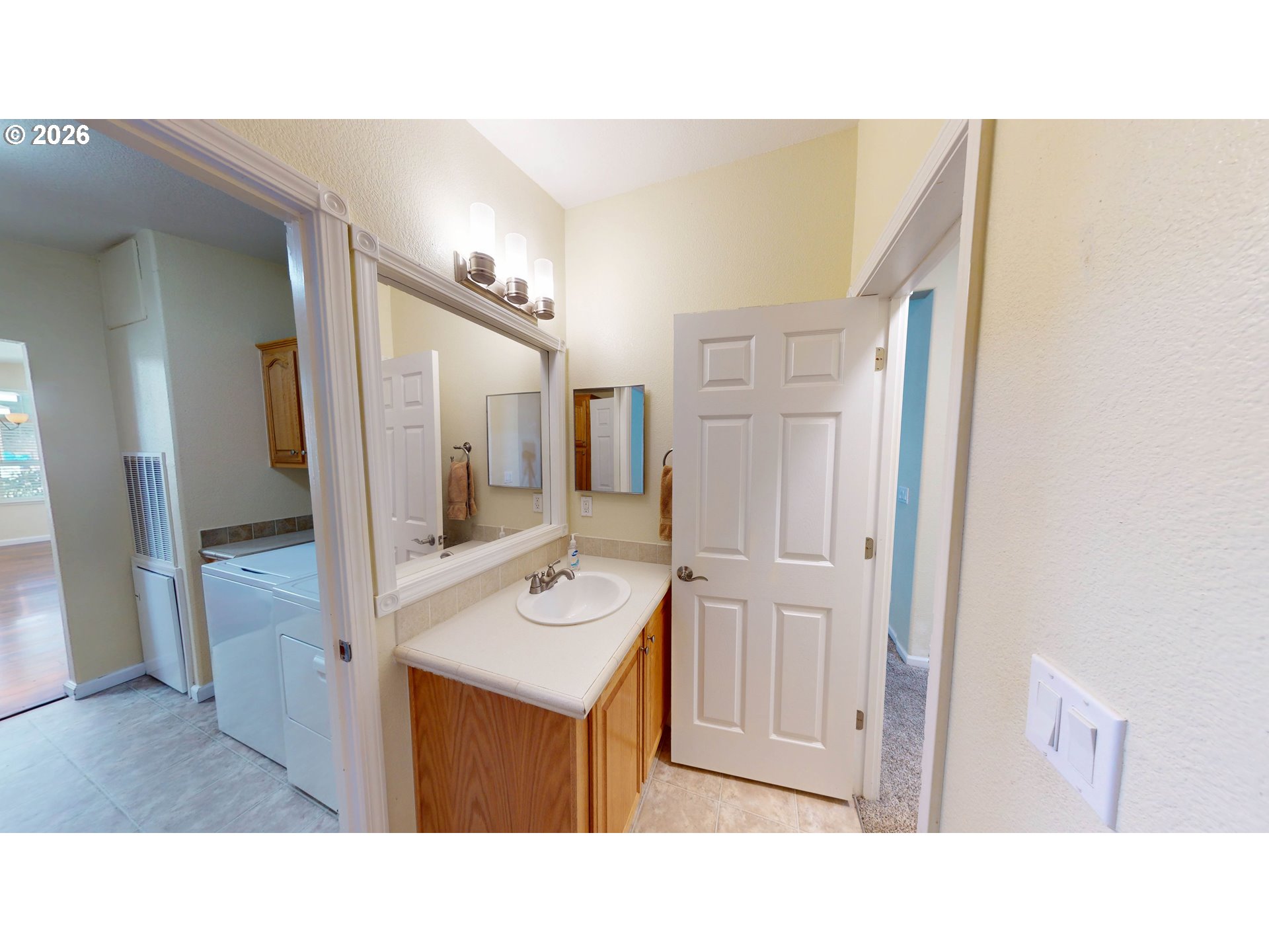 94355 11th Street Gold Beach, OR 97444 - Photo 34 of 41 a bathroom with a sink a mirror and a shower