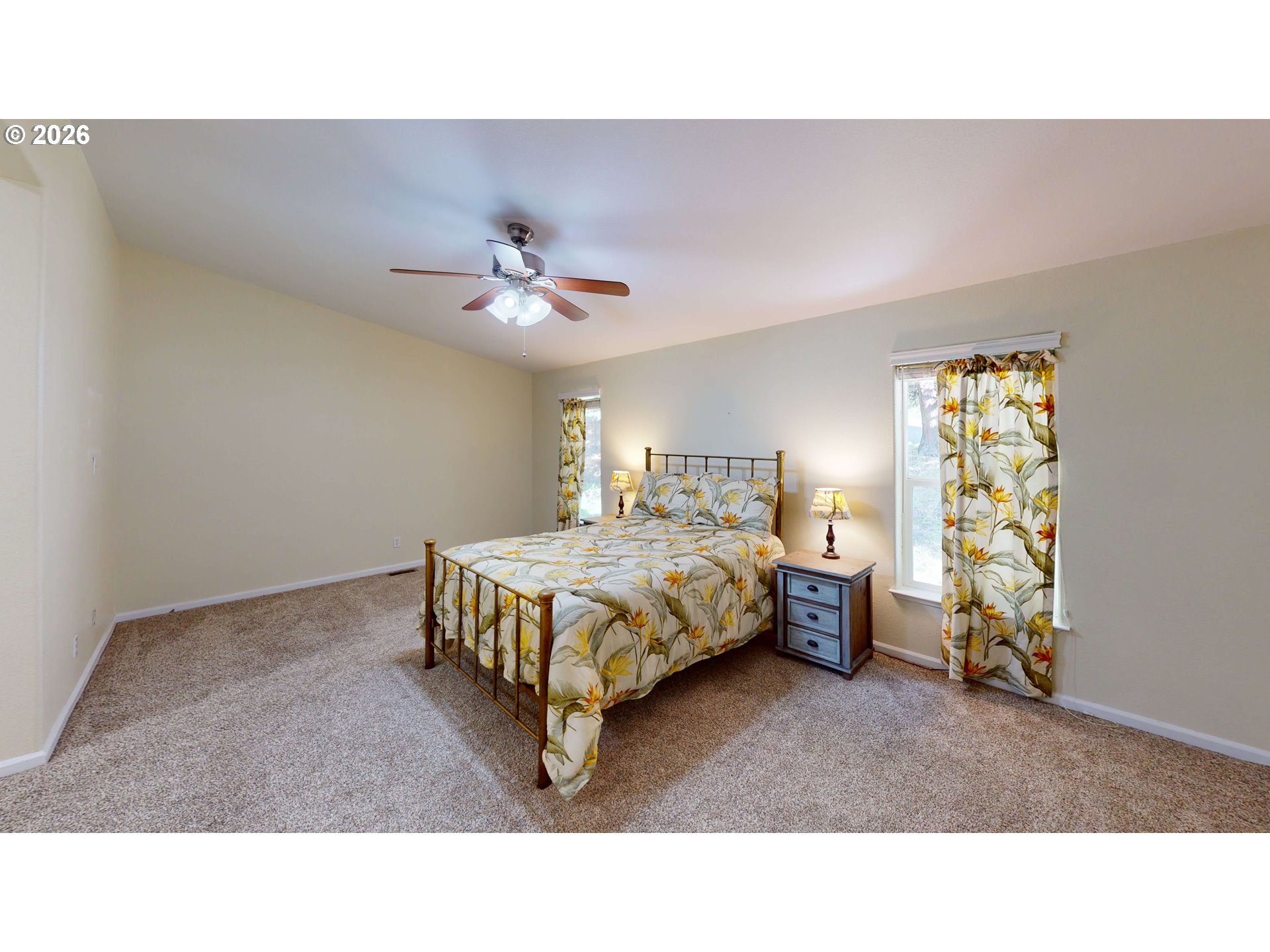 94355 11th Street Gold Beach, OR 97444 - Photo 10 of 41 a living room with a bed furniture and a chandelier