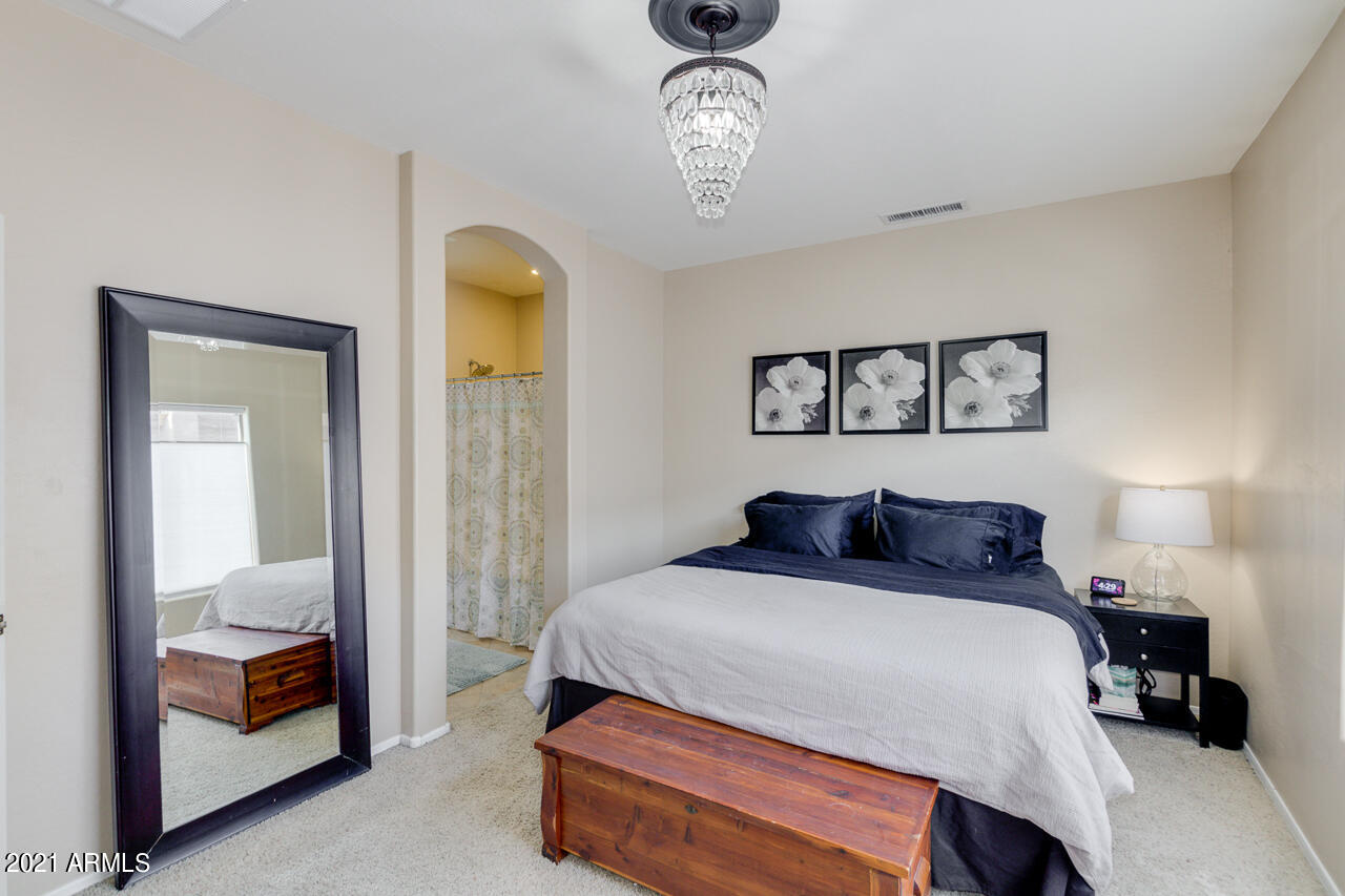 44 South Greenfield Road, Unit 48 Mesa, AZ 85206 - Photo 20 of 32 a bedroom with a bed and a mirror