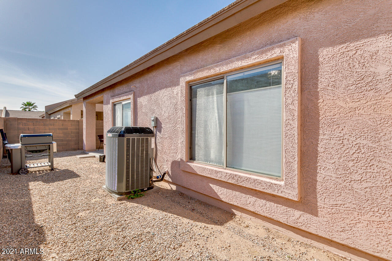 44 South Greenfield Road, Unit 48 Mesa, AZ 85206 - Photo 31 of 32 a view of a porch with a table and chairs and barbeque grill