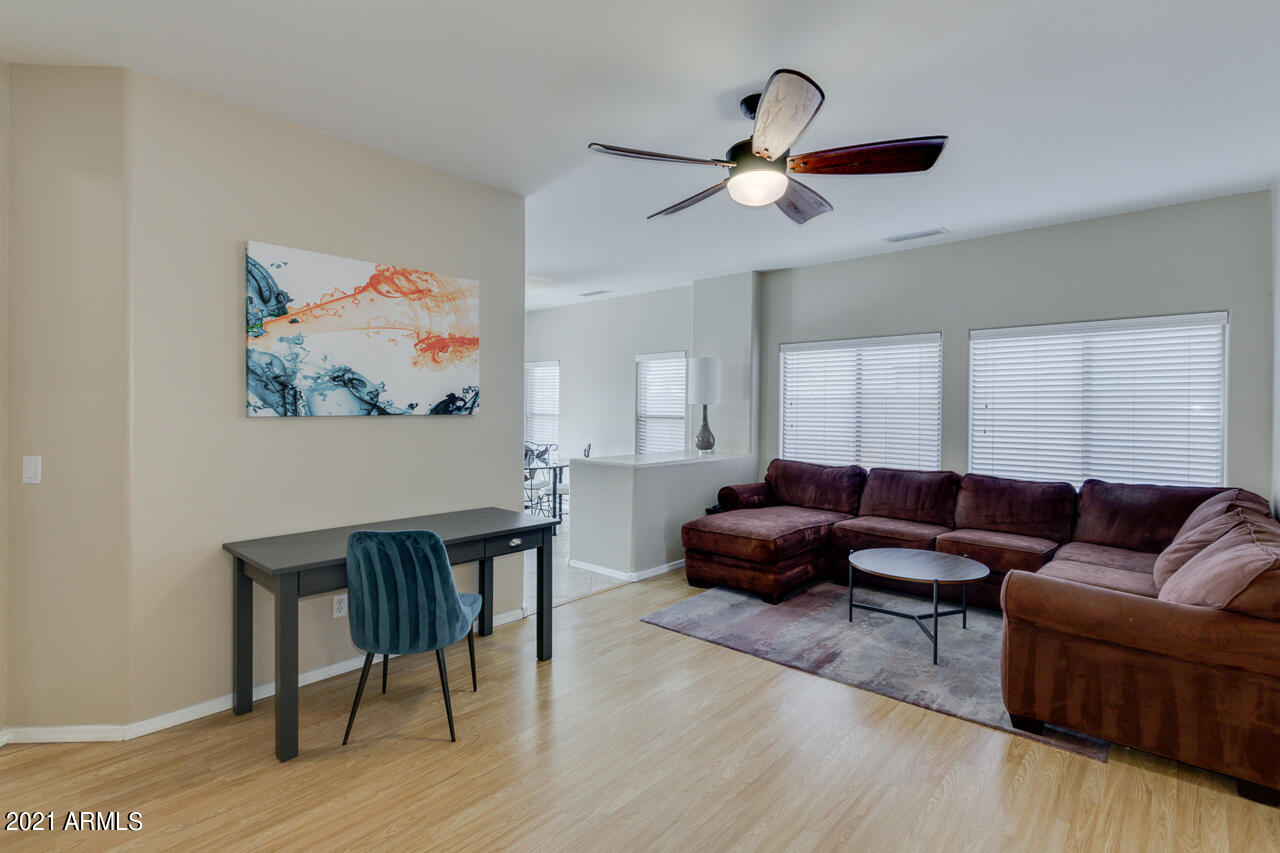 44 South Greenfield Road, Unit 48 Mesa, AZ 85206 - Photo 5 of 32 a living room with furniture and a window