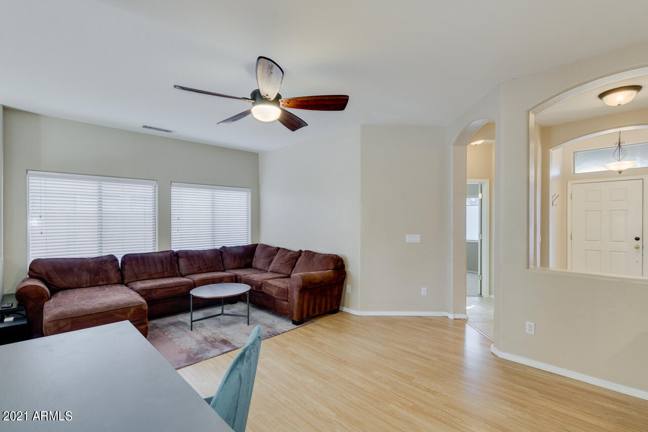 44 South Greenfield Road, Unit 48 Mesa, AZ 85206 - Photo 7 of 32 a living room with furniture and a window