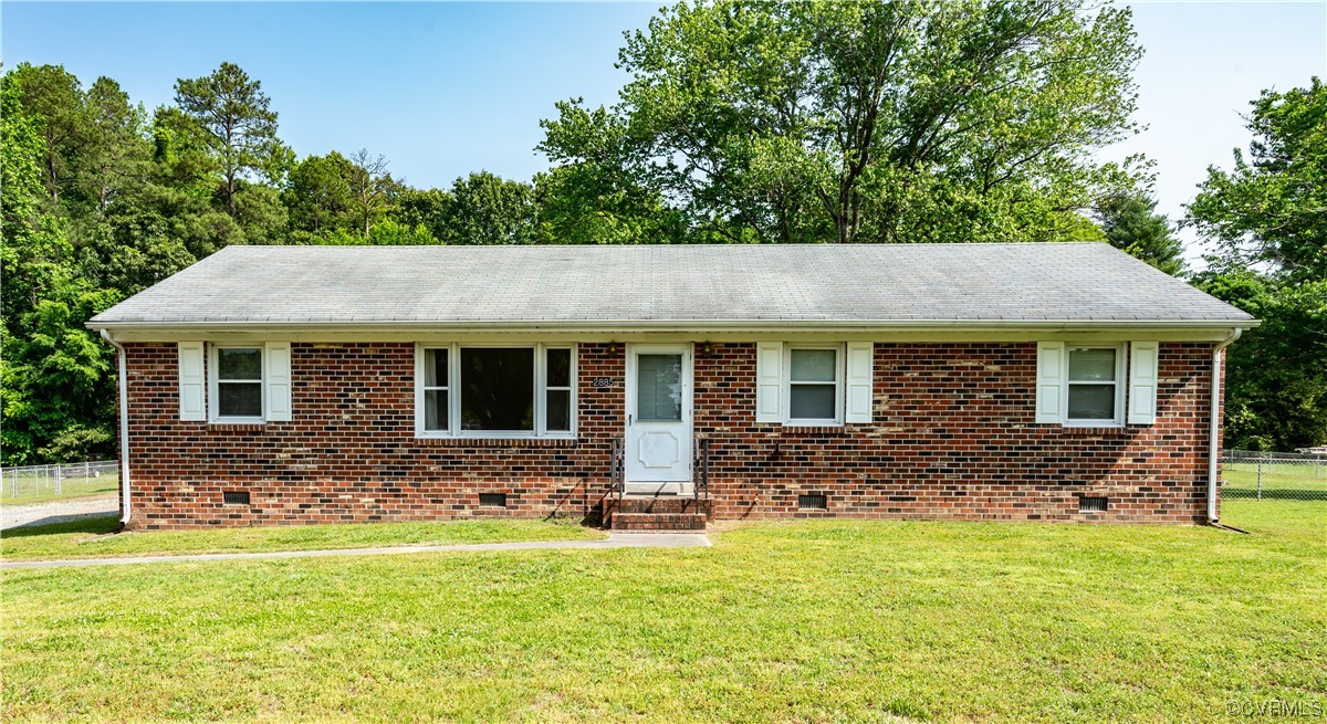 a view of house with yard outdoor space with seating area