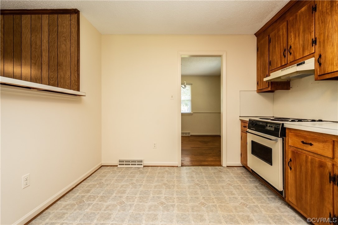 2885 Venter Road Aylett, VA 23009 - Photo 13 of 34 a view of a kitchen with a sink and a stove top oven