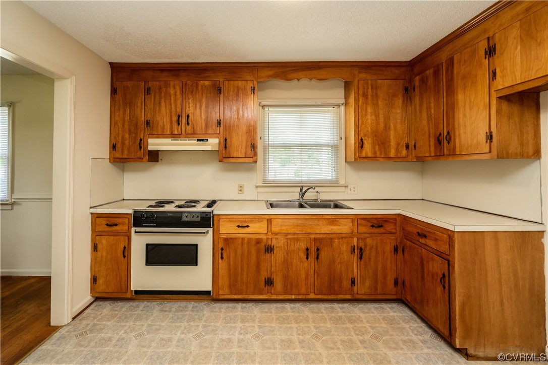 2885 Venter Road Aylett, VA 23009 - Photo 14 of 34 a kitchen with stainless steel appliances granite countertop a stove a sink dishwasher and a microwave oven with cabinets