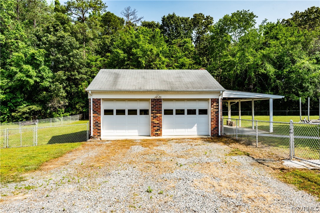 2885 Venter Road Aylett, VA 23009 - Photo 30 of 34 a view of a house with pool and garden