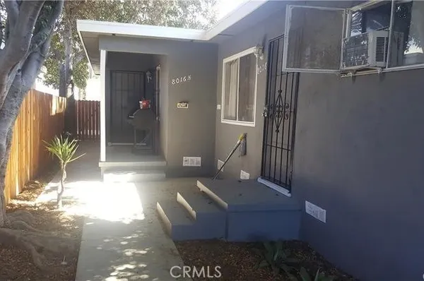 a view of backyard of a house