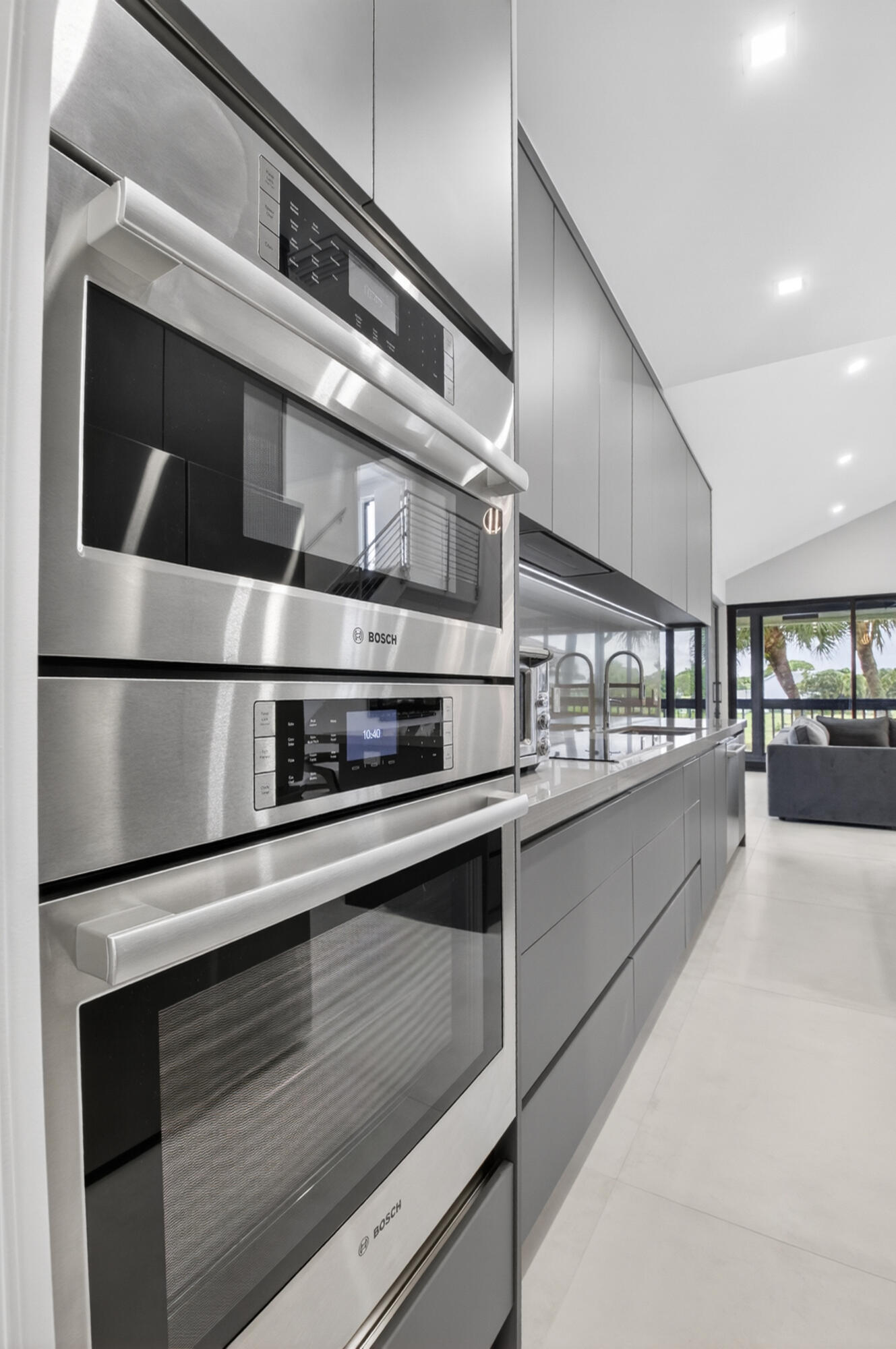 19221 Sabal Lake Drive, Unit 5124 Boca Raton, FL 33434 - Photo 10 of 98 a kitchen with stainless steel appliances granite countertop a stove and a microwave
