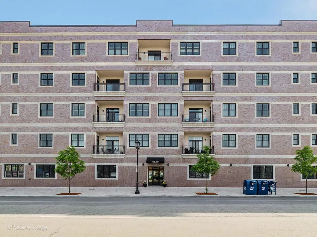 a front view of a building with parking space