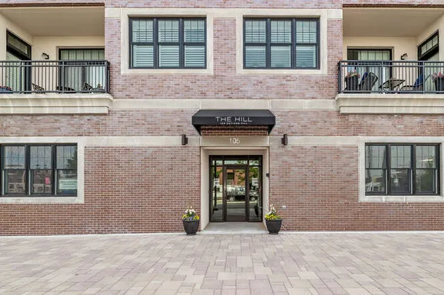 a view of a kitchen with granite countertop a oven and cabinets