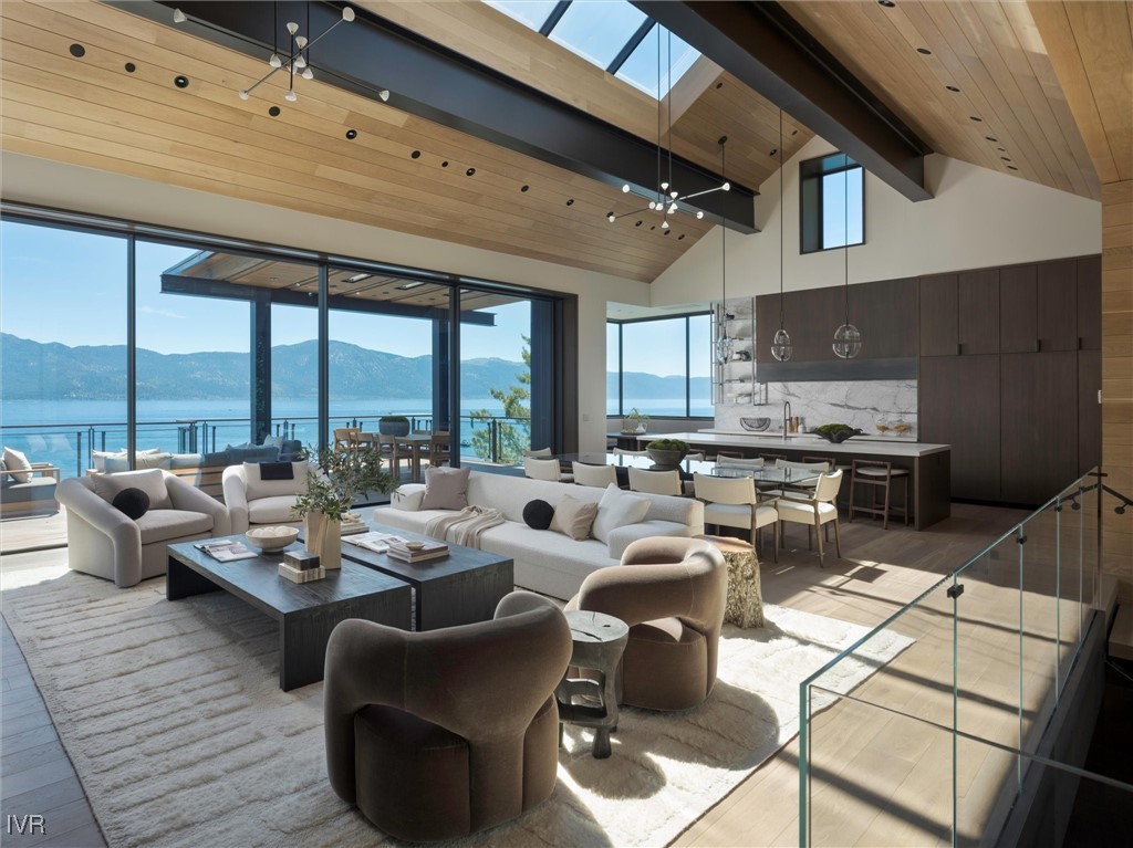 460 Gonowabie Road Crystal Bay, NV 89402 - Photo 5 of 36 a living room with fireplace furniture and a large window