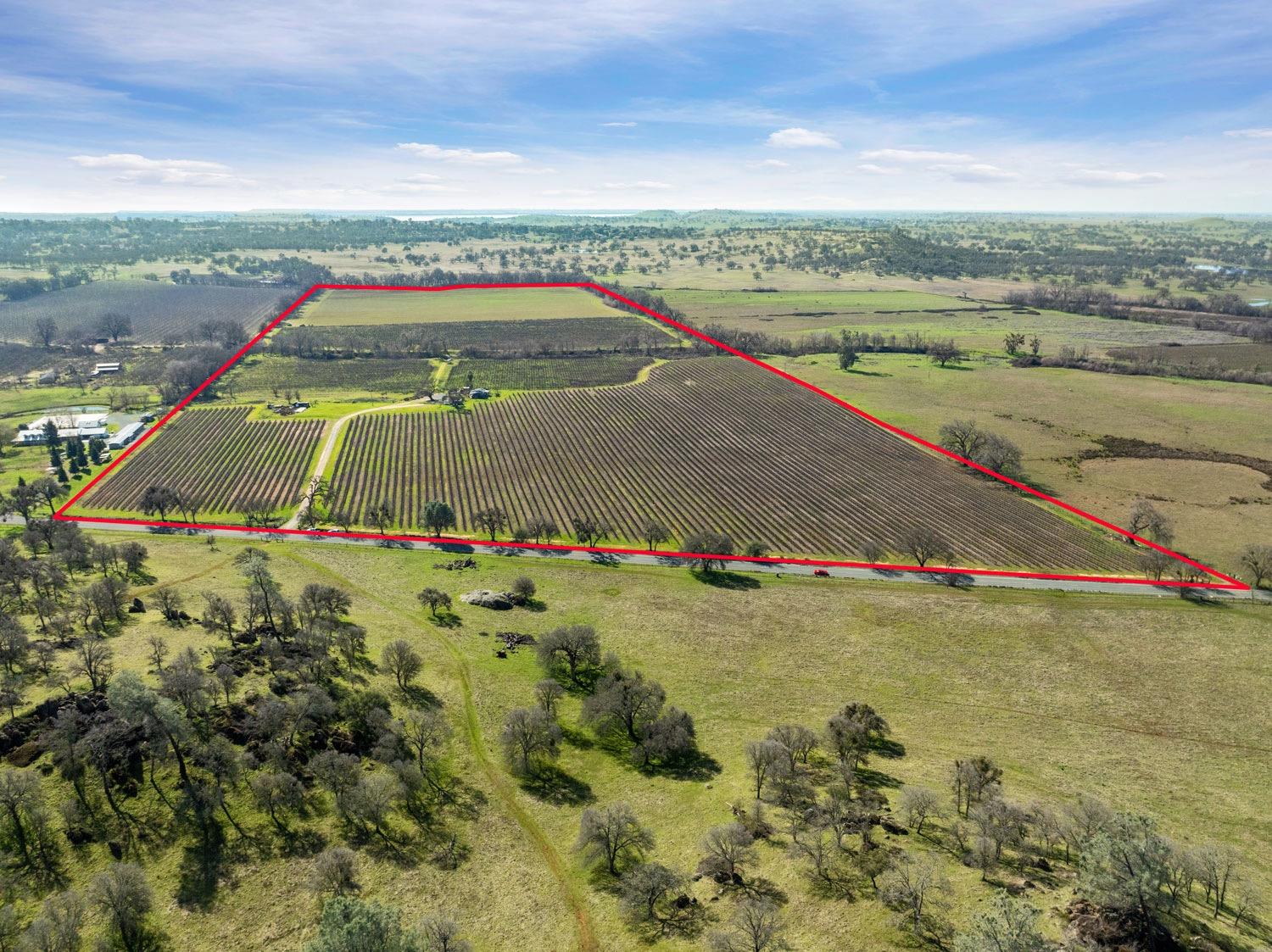 an aerial view of a houses with a yard