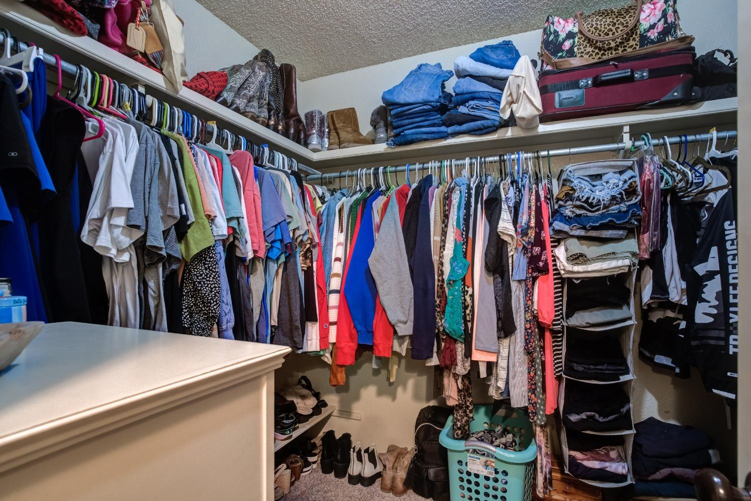 1428 5th Street Shallowater, TX 79363 - Photo 16 of 30 a view of walk in closet with clothes and shoes
