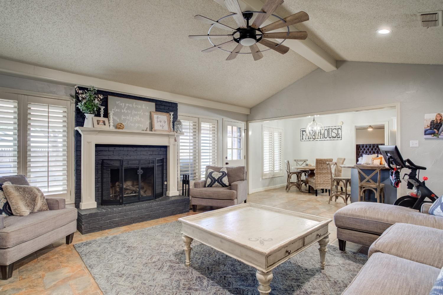 1428 5th Street Shallowater, TX 79363 - Photo 2 of 30 a living room with furniture and a fireplace