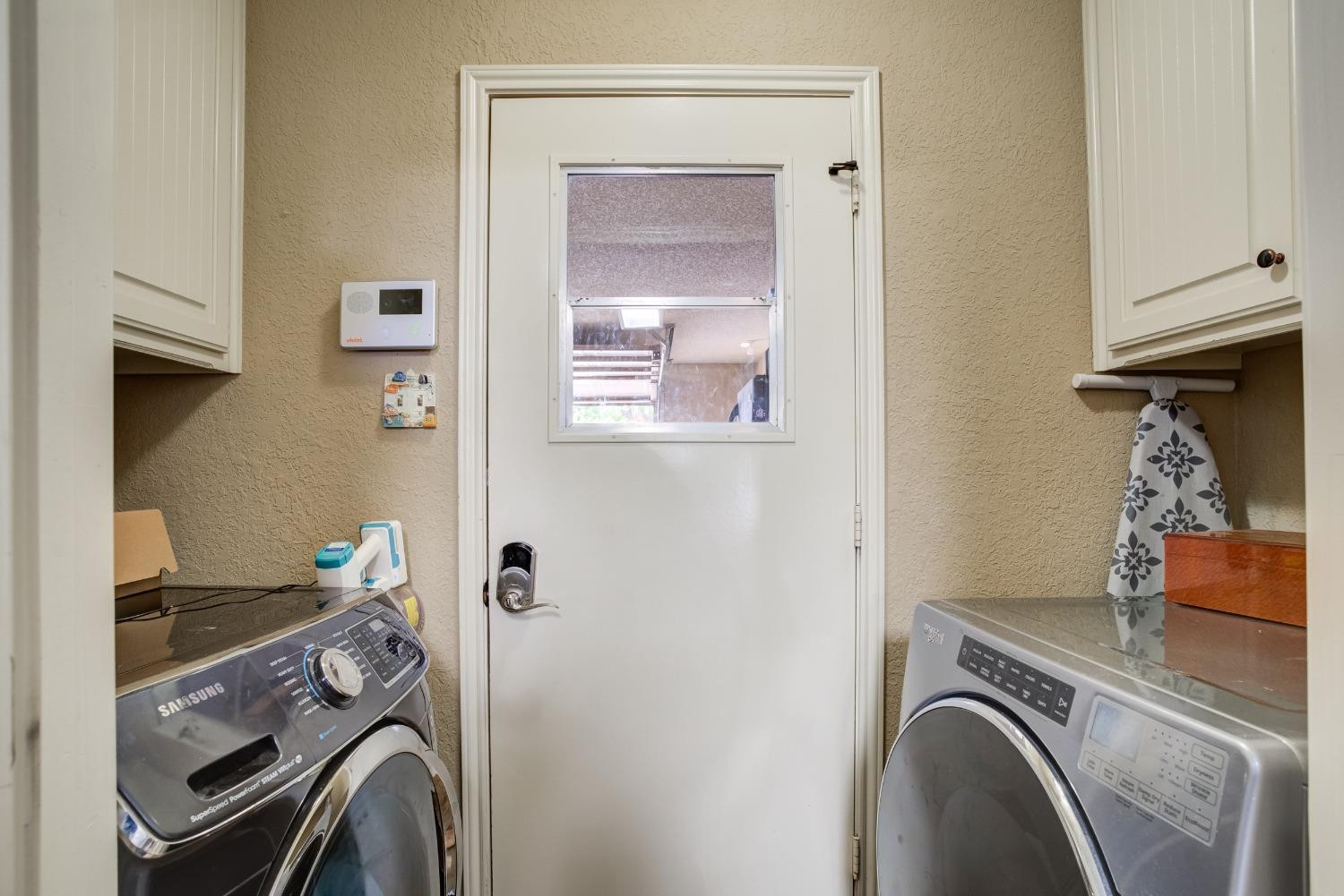 1428 5th Street Shallowater, TX 79363 - Photo 25 of 30 a utility room with sink dryer and washer