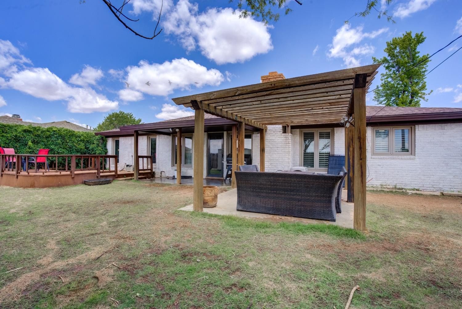 1428 5th Street Shallowater, TX 79363 - Photo 29 of 30 a view of a house with a backyard and a patio