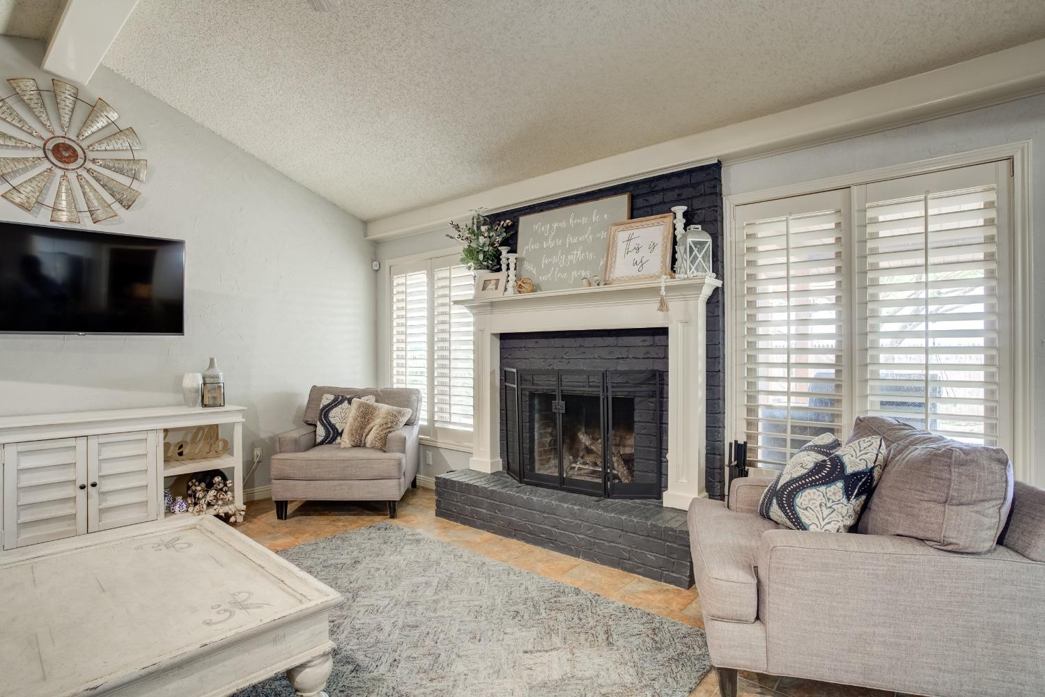 1428 5th Street Shallowater, TX 79363 - Photo 3 of 30 a living room with furniture and a fireplace