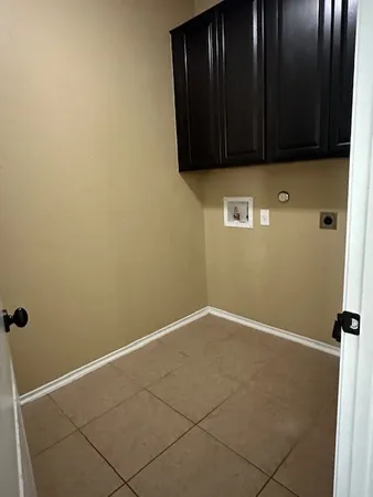 a view of kitchen with wooden floor and electronic appliances