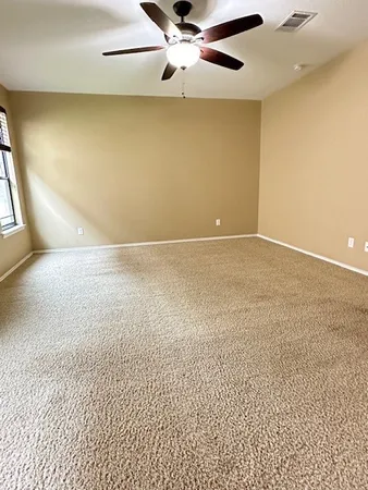 a view of a bathroom with a sink and a mirror