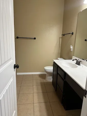 an empty room with large windows