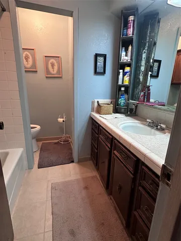 a view of swimming pool with outdoor seating and yard in back