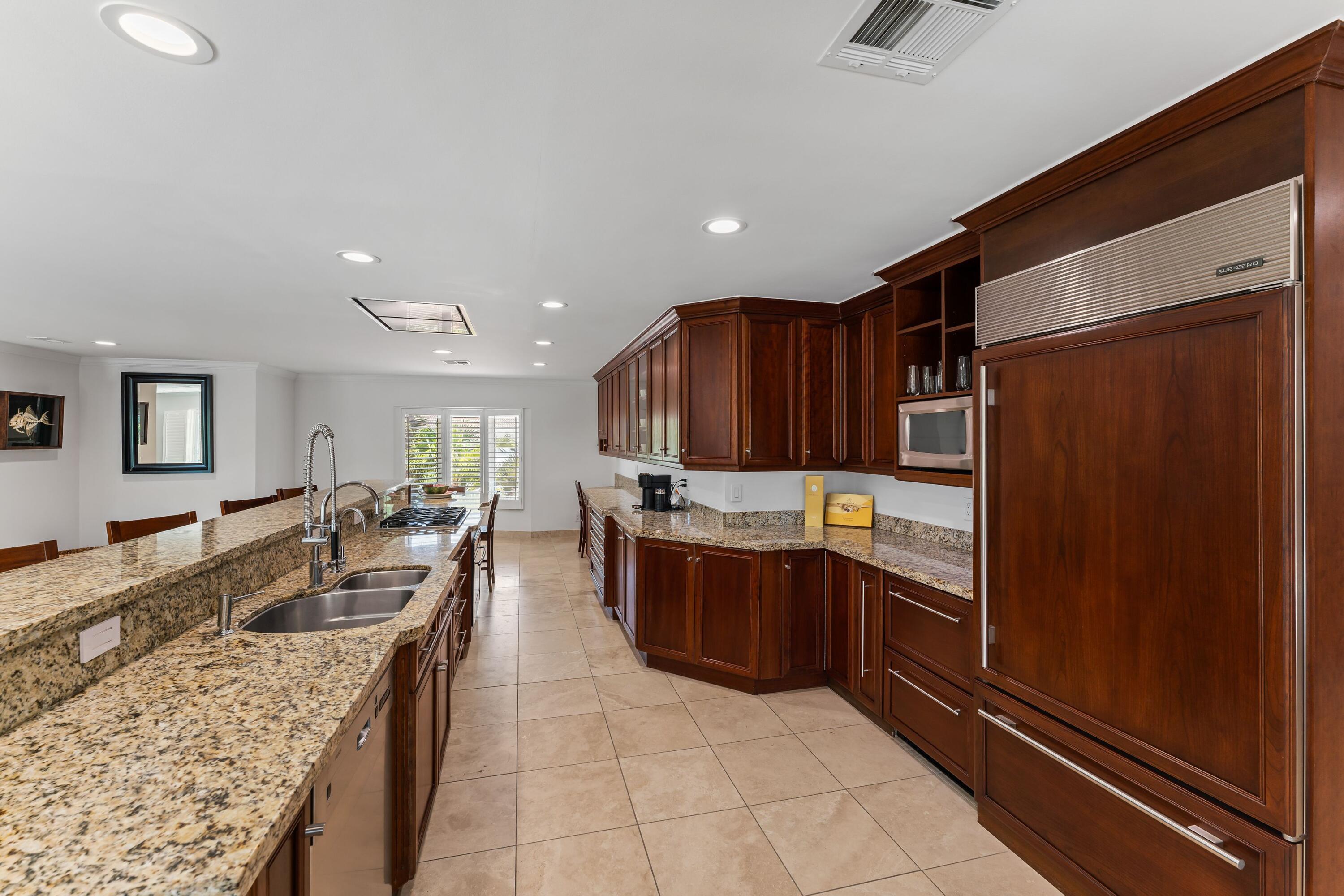 18150 Perigon Way Jupiter, FL 33458 - Photo 14 of 57 a large kitchen with granite countertop lots of counter top space
