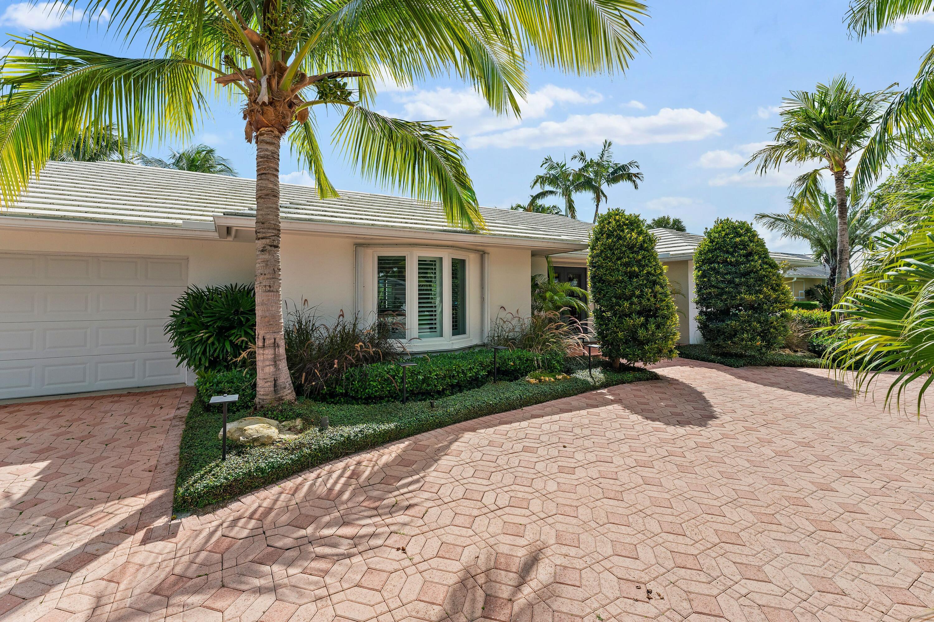 18150 Perigon Way Jupiter, FL 33458 - Photo 17 of 57 a view of a backyard of a house