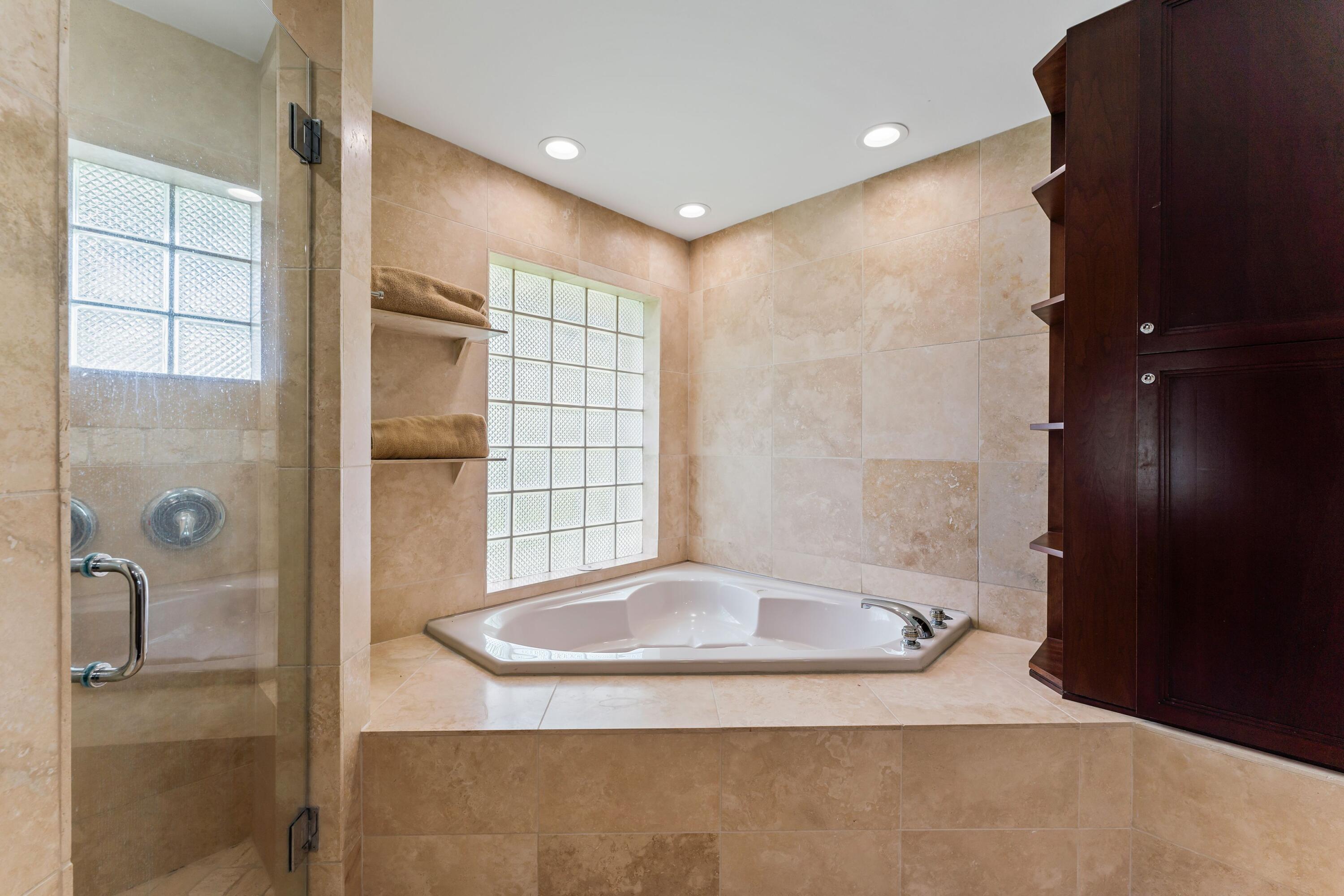 18150 Perigon Way Jupiter, FL 33458 - Photo 22 of 57 a bathroom with a shower