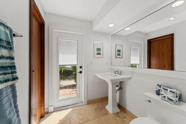 a bathroom with a sink a mirror and a bathtub