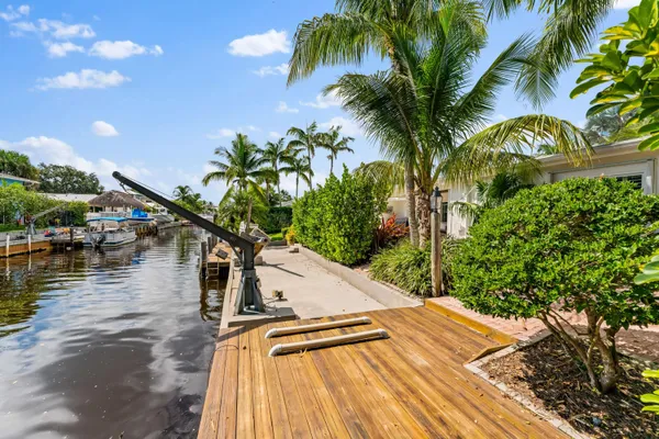 an aerial view of a house with yard and mountain view in back