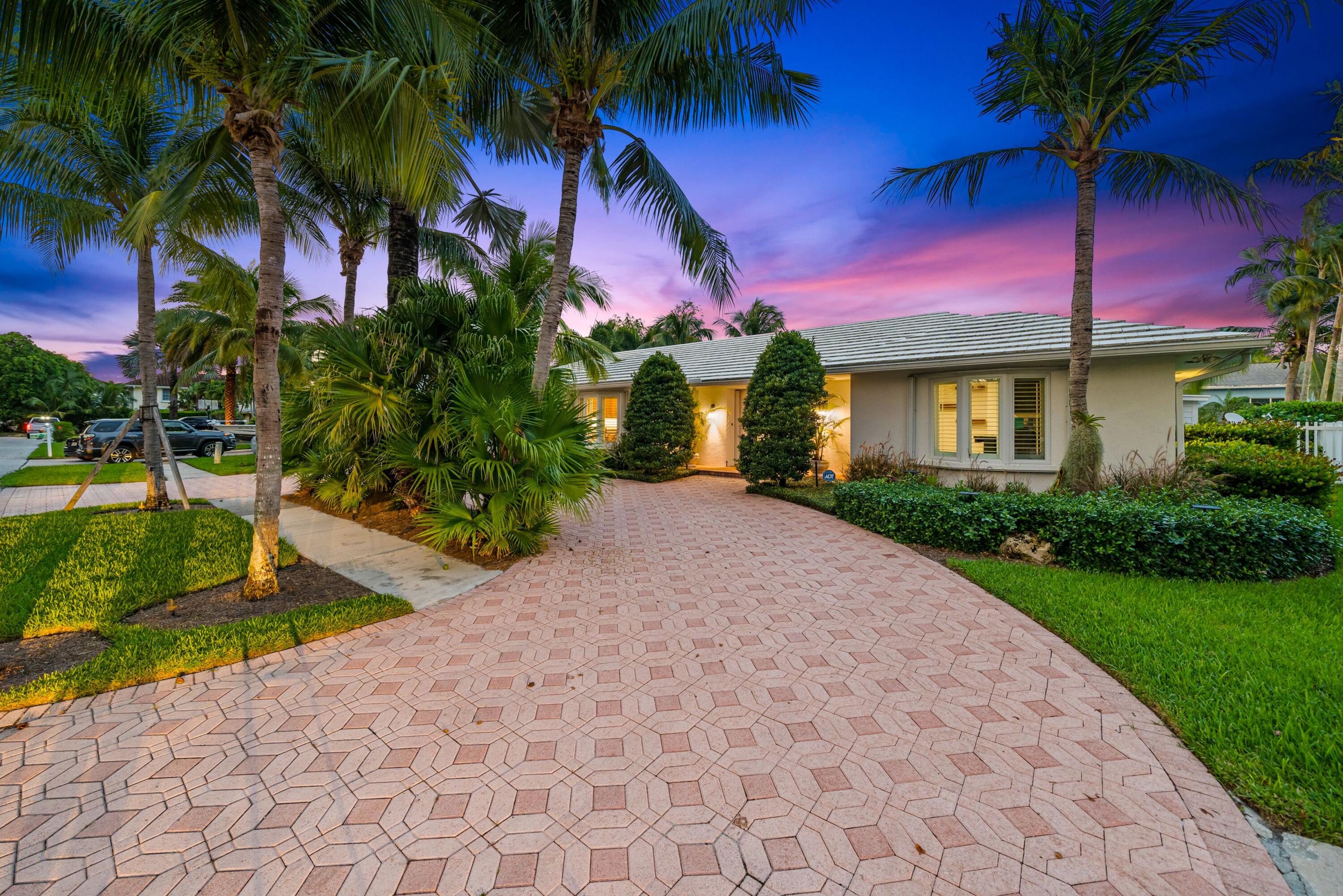 18150 Perigon Way Jupiter, FL 33458 - Photo 52 of 57 a view of a yard in front of a house